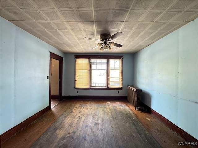 64 Timon St, Buffalo, NY 14211 - empty room with a ceiling fan, hardwood / wood-style flooring, and an ornate ceiling