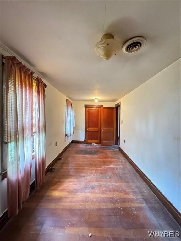 64 Timon St, Buffalo, NY 14211 - spare room featuring baseboards and dark wood-style floors