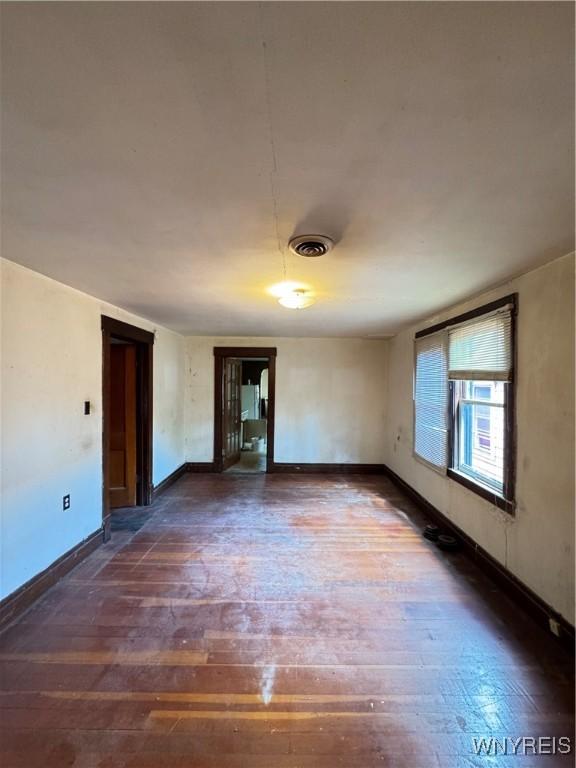 64 Timon St, Buffalo, NY 14211 - spare room with hardwood / wood-style flooring and baseboards