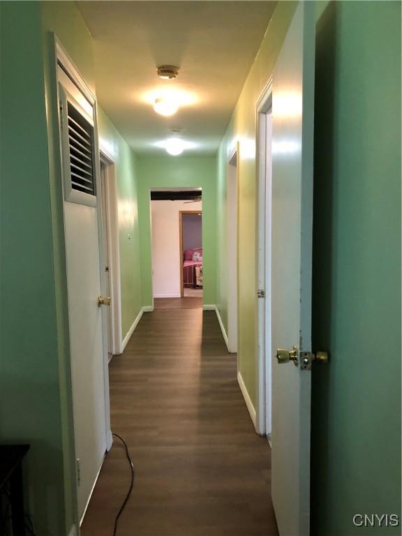 1407 N James St, Rome-Inside, NY 13440 - hall featuring dark wood-style flooring and baseboards