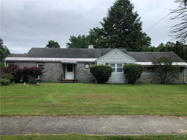1407 N James St, Rome-Inside, NY 13440 - ranch-style home featuring a front yard, stone siding, and a shingled roof