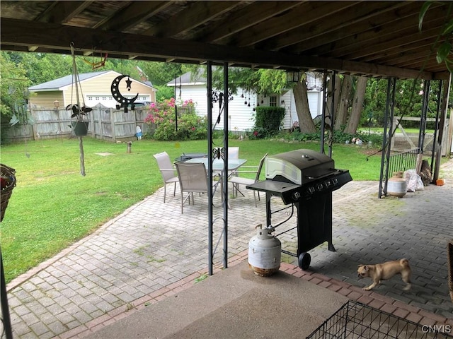 1407 N James St, Rome-Inside, NY 13440 - view of patio / terrace featuring grilling area, outdoor dining space, and an outdoor structure