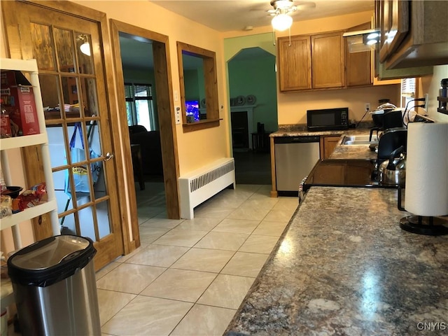 1407 N James St, Rome-Inside, NY 13440 - kitchen with dishwasher, black microwave, radiator, dark countertops, and brown cabinets