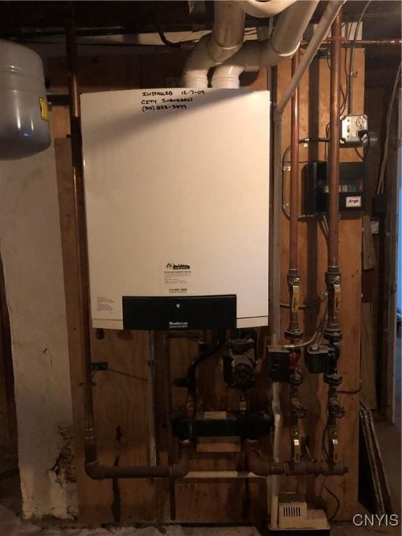 1407 N James St, Rome-Inside, NY 13440 - utility room with tankless water heater