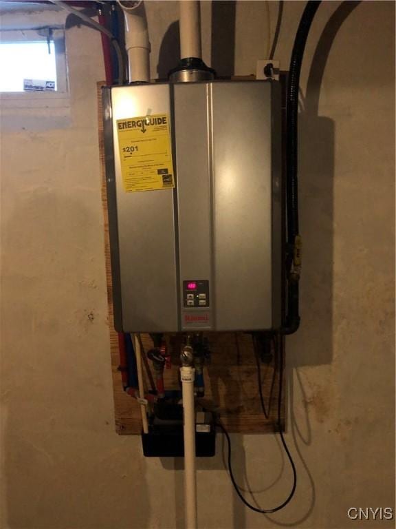 1407 N James St, Rome-Inside, NY 13440 - utility room with tankless water heater