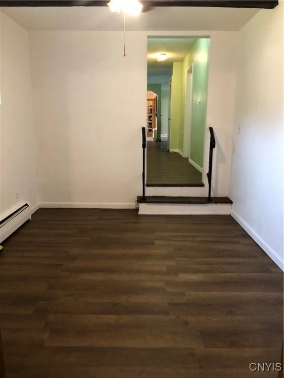 1407 N James St, Rome-Inside, NY 13440 - spare room featuring baseboard heating, a ceiling fan, and wood finished floors
