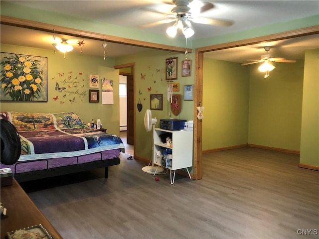 1407 N James St, Rome-Inside, NY 13440 - bedroom with wood finished floors, a baseboard radiator, and a ceiling fan