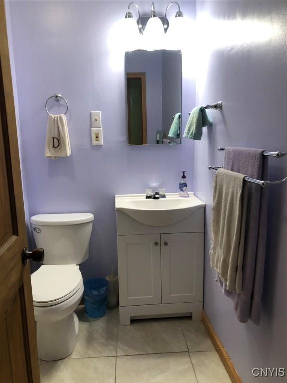 1407 N James St, Rome-Inside, NY 13440 - half bathroom with vanity and tile patterned flooring