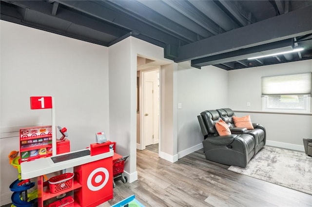 716 Flynn Rd, Greece, NY 14612 - recreation room with wood finished floors and baseboards
