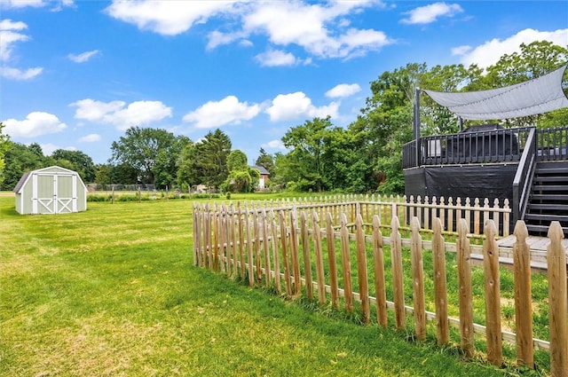 716 Flynn Rd, Greece, NY 14612 - view of yard featuring a wooden deck, a storage unit, and stairs