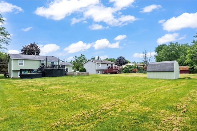 716 Flynn Rd, Greece, NY 14612 - view of grassy yard with a shed and a wooden deck