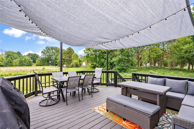 716 Flynn Rd, Greece, NY 14612 - deck featuring outdoor dining space, view of scattered trees, a lawn, and area for grilling