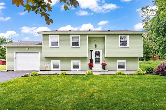 716 Flynn Rd, Greece, NY 14612 - bi-level home featuring a garage, a front lawn, and asphalt driveway