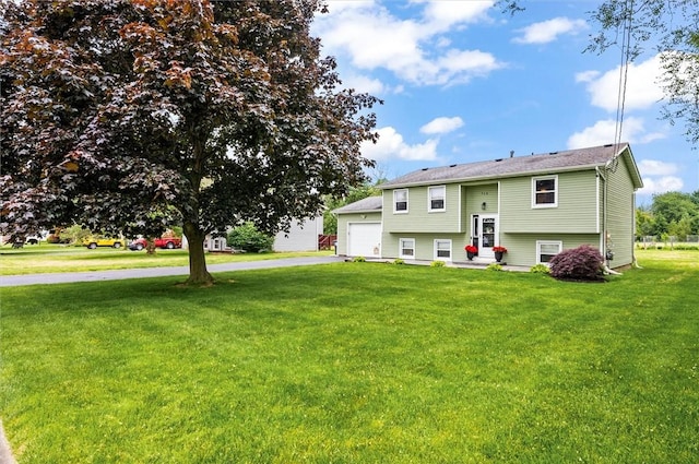 716 Flynn Rd, Greece, NY 14612 - split foyer home featuring a front yard, driveway, and a garage
