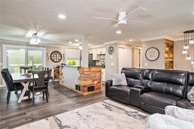 716 Flynn Rd, Greece, NY 14612 - living area with crown molding, dark wood-style flooring, ceiling fan, a textured ceiling, and recessed lighting