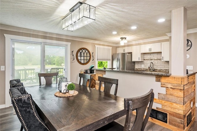 716 Flynn Rd, Greece, NY 14612 - dining area with crown molding, dark wood-style flooring, a textured ceiling, recessed lighting, and a chandelier