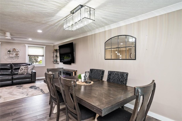 716 Flynn Rd, Greece, NY 14612 - dining room with wood finished floors, a textured ceiling, crown molding, and recessed lighting
