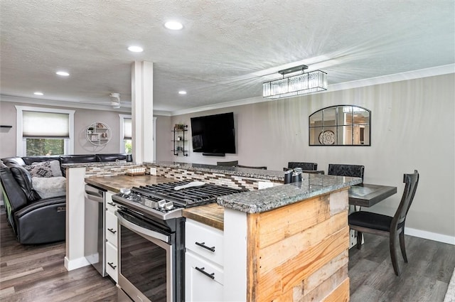 716 Flynn Rd, Greece, NY 14612 - kitchen with open floor plan, appliances with stainless steel finishes, white cabinetry, crown molding, and recessed lighting