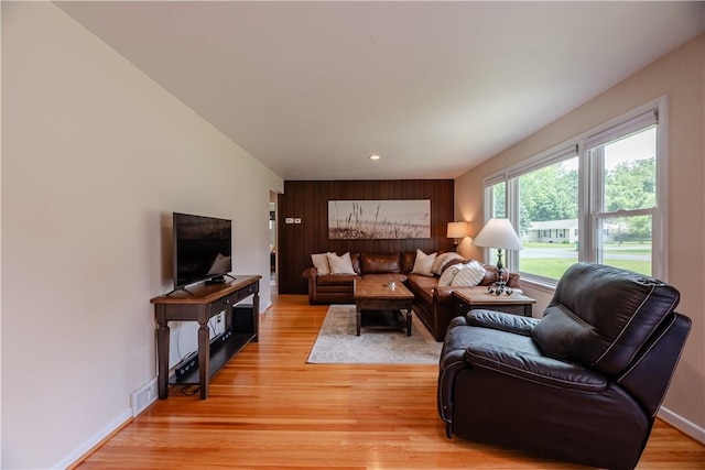 284 Woodruff Dr, Webster, NY 14580 - living room featuring light wood-style flooring, wood walls, and recessed lighting
