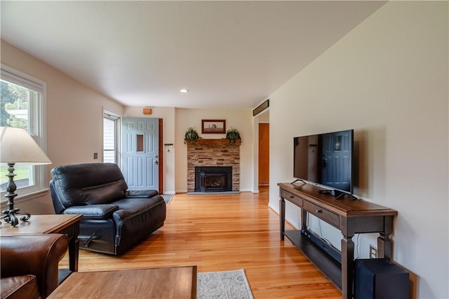 284 Woodruff Dr, Webster, NY 14580 - living area with light wood finished floors, a fireplace, and recessed lighting