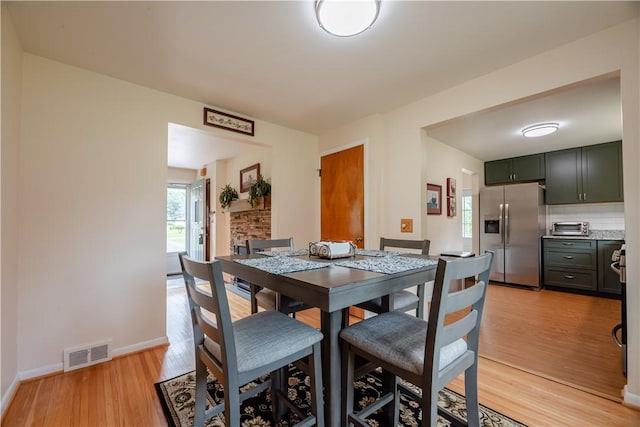 284 Woodruff Dr, Webster, NY 14580 - dining space featuring light wood finished floors and baseboards