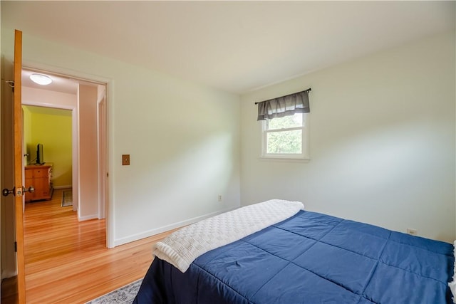 284 Woodruff Dr, Webster, NY 14580 - bedroom with light wood-style flooring and baseboards