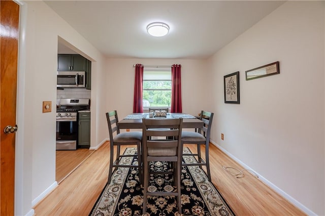 284 Woodruff Dr, Webster, NY 14580 - dining area with light wood finished floors