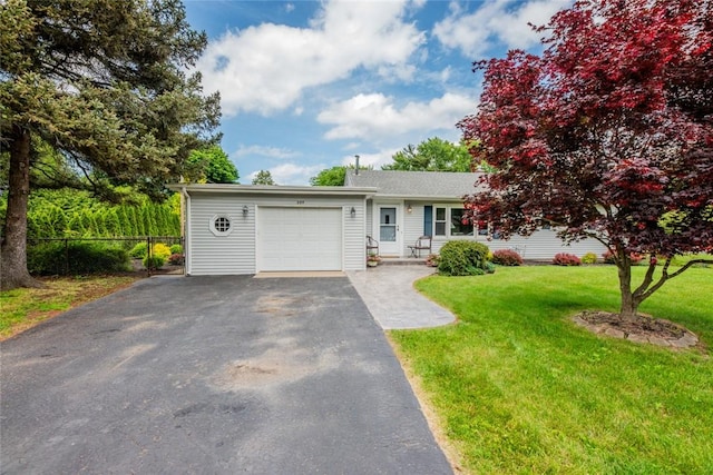284 Woodruff Dr, Webster, NY 14580 - view of front of property featuring a garage and asphalt driveway