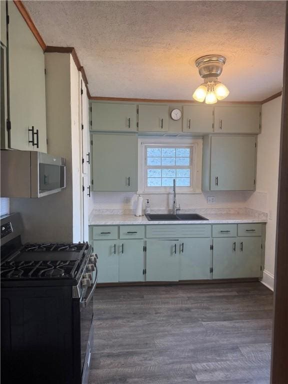 340 Webber Pl, Elmira-City, NY 14901 - kitchen featuring gas stove, white microwave, crown molding, a textured ceiling, and light countertops