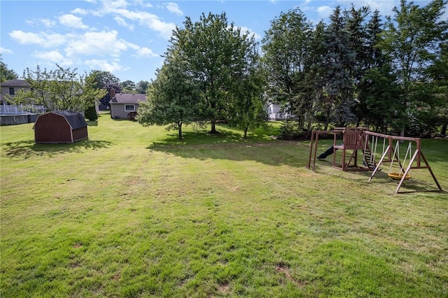 55 Creighton Ln, Greece, NY 14612 - view of grassy yard with a shed and a playground