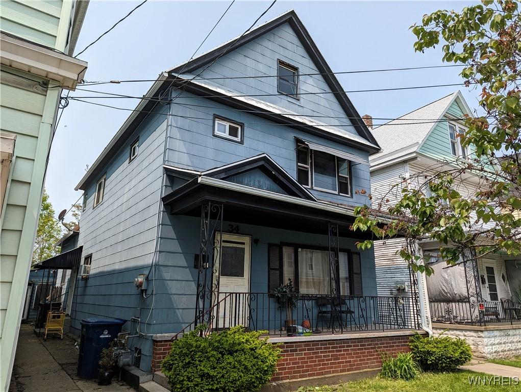 34 Reservation St, Buffalo, NY 14207 - shotgun-style home featuring covered porch