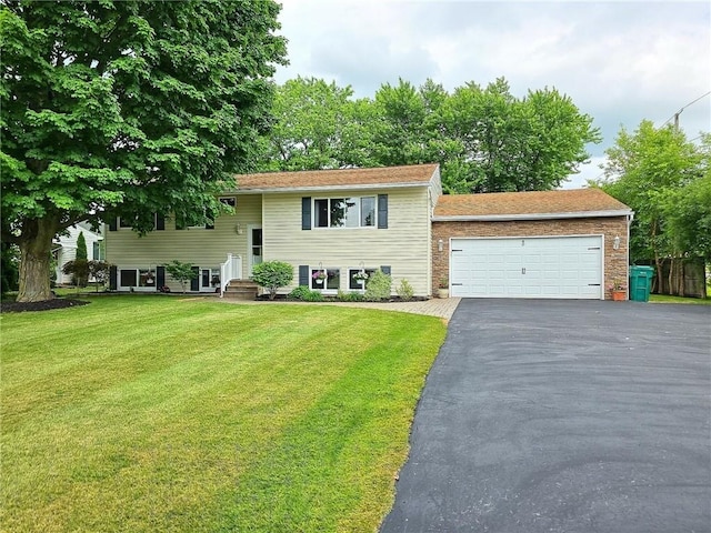 40 Ice Rose Ln, Henrietta, NY 14623 - raised ranch featuring asphalt driveway, an attached garage, and a front lawn