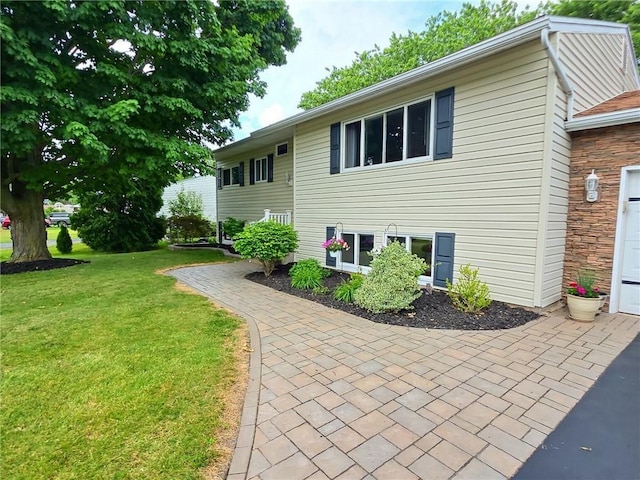 40 Ice Rose Ln, Henrietta, NY 14623 - view of property exterior featuring a yard