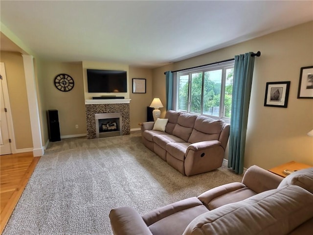 40 Ice Rose Ln, Henrietta, NY 14623 - living area with a tile fireplace and baseboards
