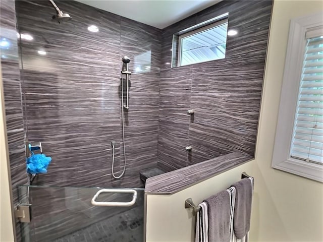 40 Ice Rose Ln, Henrietta, NY 14623 - full bathroom featuring a tile shower
