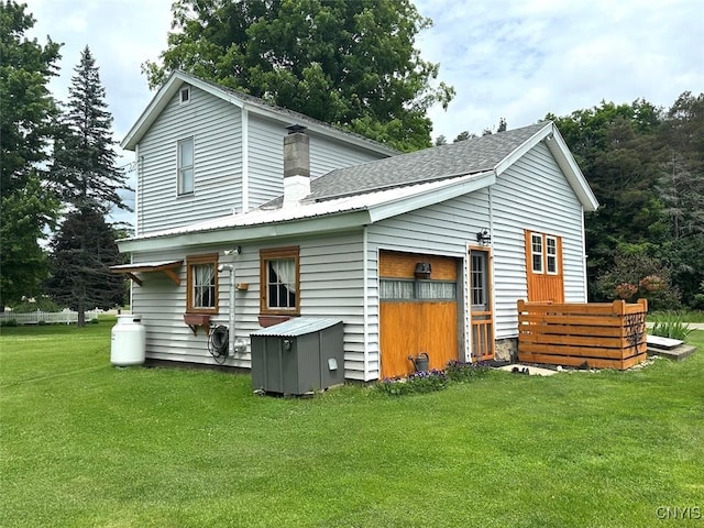 11797 State Route 70, Grove, NY 14884 - rear view of property featuring a lawn and roof with shingles