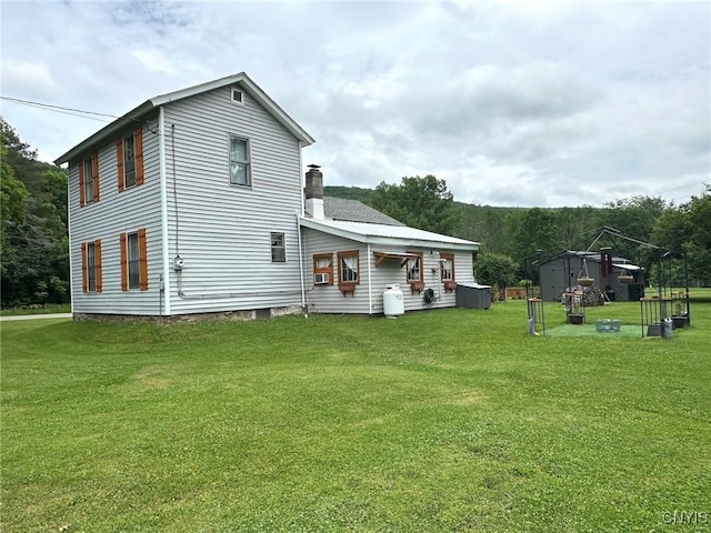 11797 State Route 70, Grove, NY 14884 - rear view of house featuring a yard and a chimney