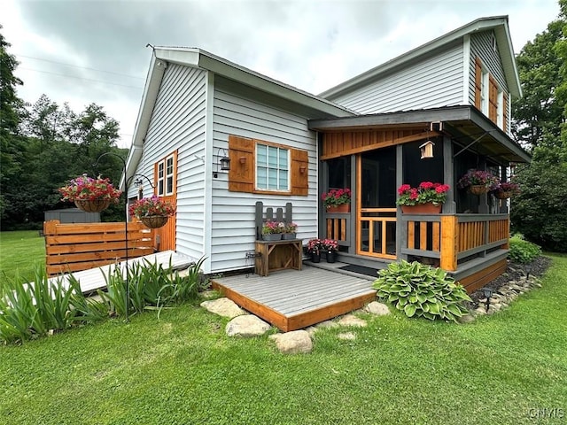 11797 State Route 70, Grove, NY 14884 - rear view of house featuring a yard and a sunroom
