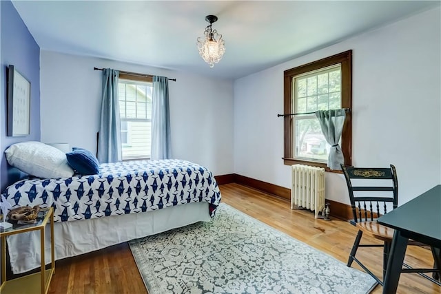 79 Rawlinson Rd, Irondequoit, NY 14617 - bedroom featuring radiator heating unit and wood finished floors
