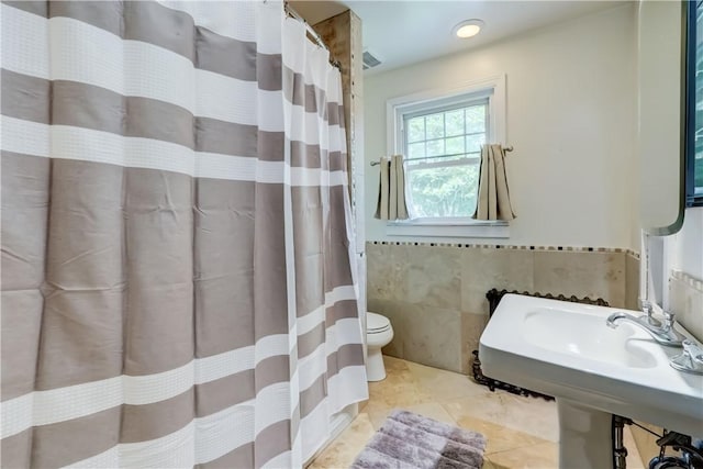 79 Rawlinson Rd, Irondequoit, NY 14617 - bathroom featuring tile walls, tile patterned flooring, and a shower with shower curtain