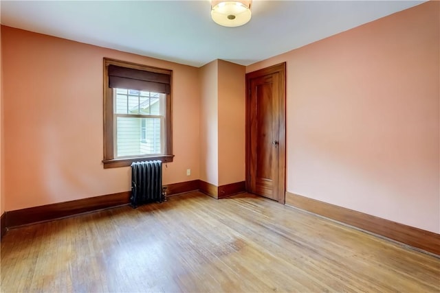 79 Rawlinson Rd, Irondequoit, NY 14617 - spare room featuring radiator heating unit and wood finished floors