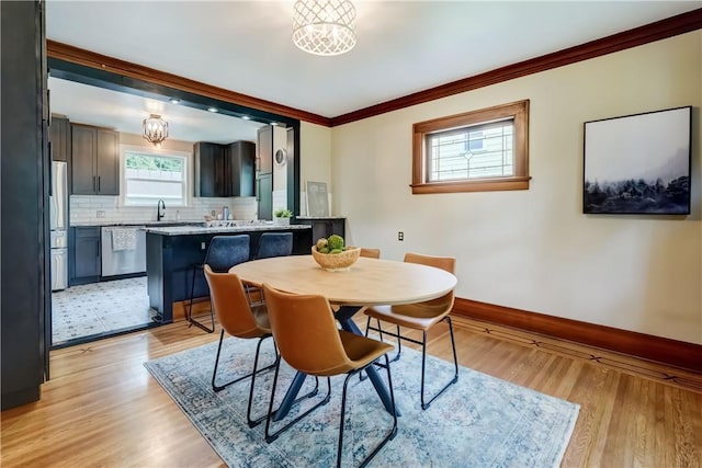 79 Rawlinson Rd, Irondequoit, NY 14617 - dining area featuring ornamental molding and light wood-style flooring