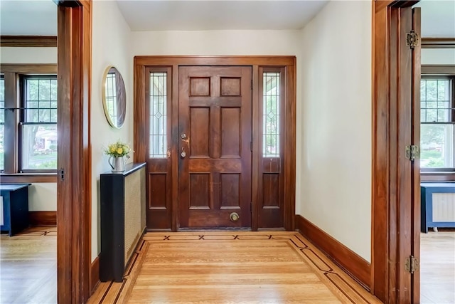 79 Rawlinson Rd, Irondequoit, NY 14617 - foyer entrance with light wood-type flooring and baseboards