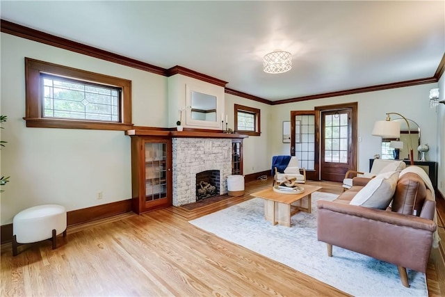 79 Rawlinson Rd, Irondequoit, NY 14617 - living area with light wood-style floors, healthy amount of natural light, a fireplace, and crown molding