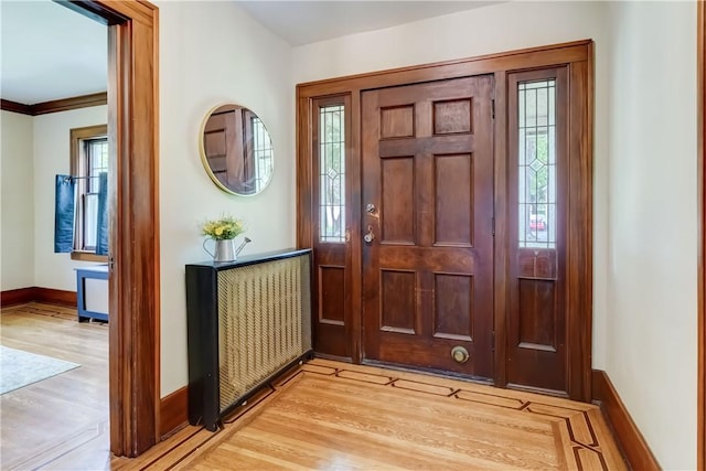79 Rawlinson Rd, Irondequoit, NY 14617 - foyer entrance featuring light wood-type flooring and crown molding