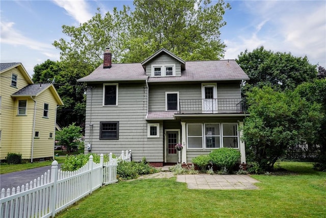 79 Rawlinson Rd, Irondequoit, NY 14617 - traditional style home featuring a balcony, a chimney, and a patio area