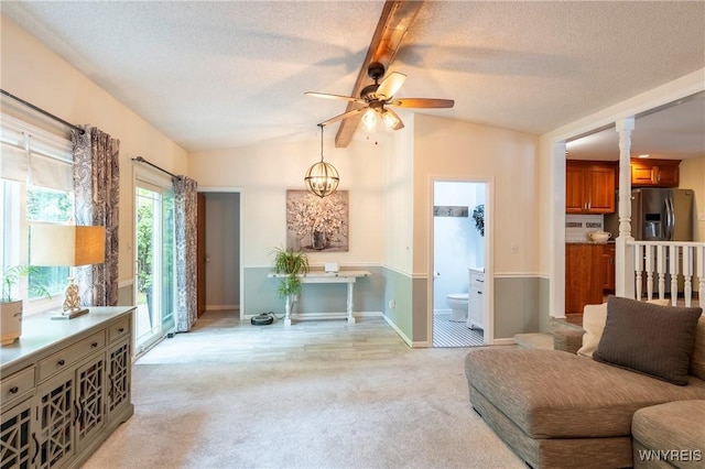 232 Kenview Blvd, Cheektowaga, NY 14215 - living room with a ceiling fan, lofted ceiling, light colored carpet, a textured ceiling, and ornate columns