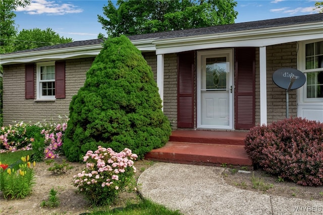 218 Hall Rd, Lancaster, NY 14059 - doorway to property with brick siding