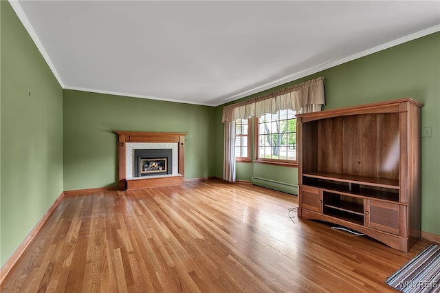 218 Hall Rd, Lancaster, NY 14059 - unfurnished living room featuring baseboard heating, wood finished floors, ornamental molding, and a fireplace with raised hearth