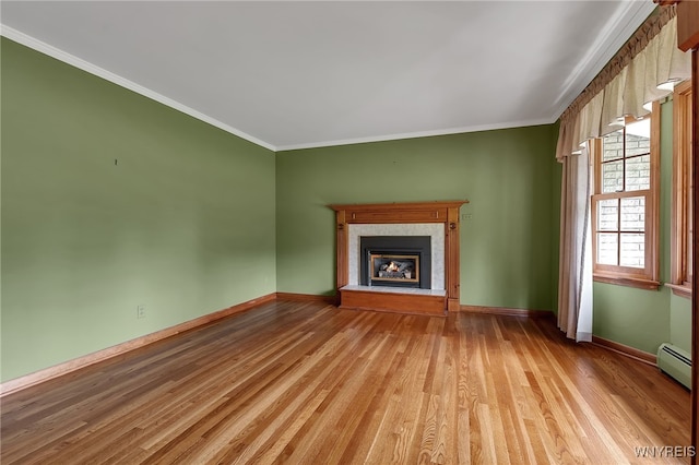 218 Hall Rd, Lancaster, NY 14059 - unfurnished living room with wood finished floors, ornamental molding, a glass covered fireplace, and a baseboard heating unit